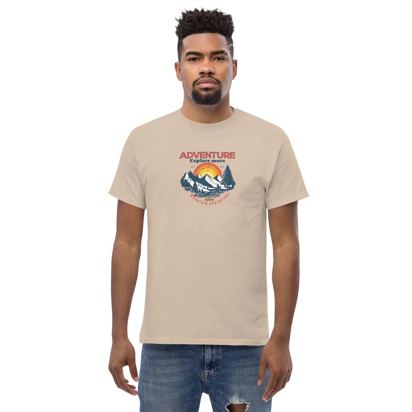 Beige t-shirt with adventure graphic.